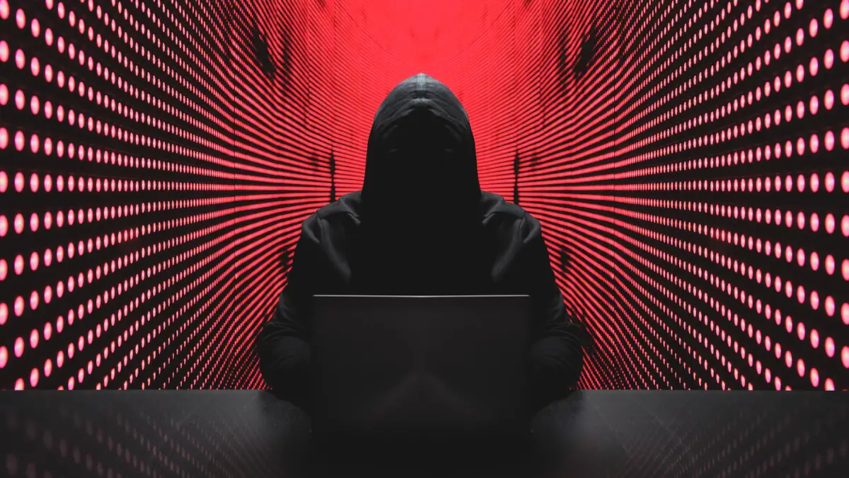 Sicherheit bei Apple: Anonymer Hacker vor rotem Hintergrund